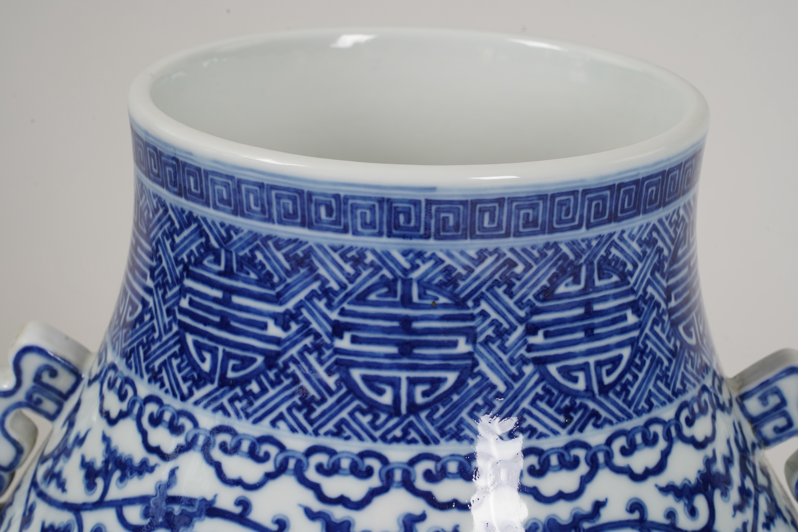 A large Chinese blue and white pear shaped vase, hu, Qianlong seal mark but later